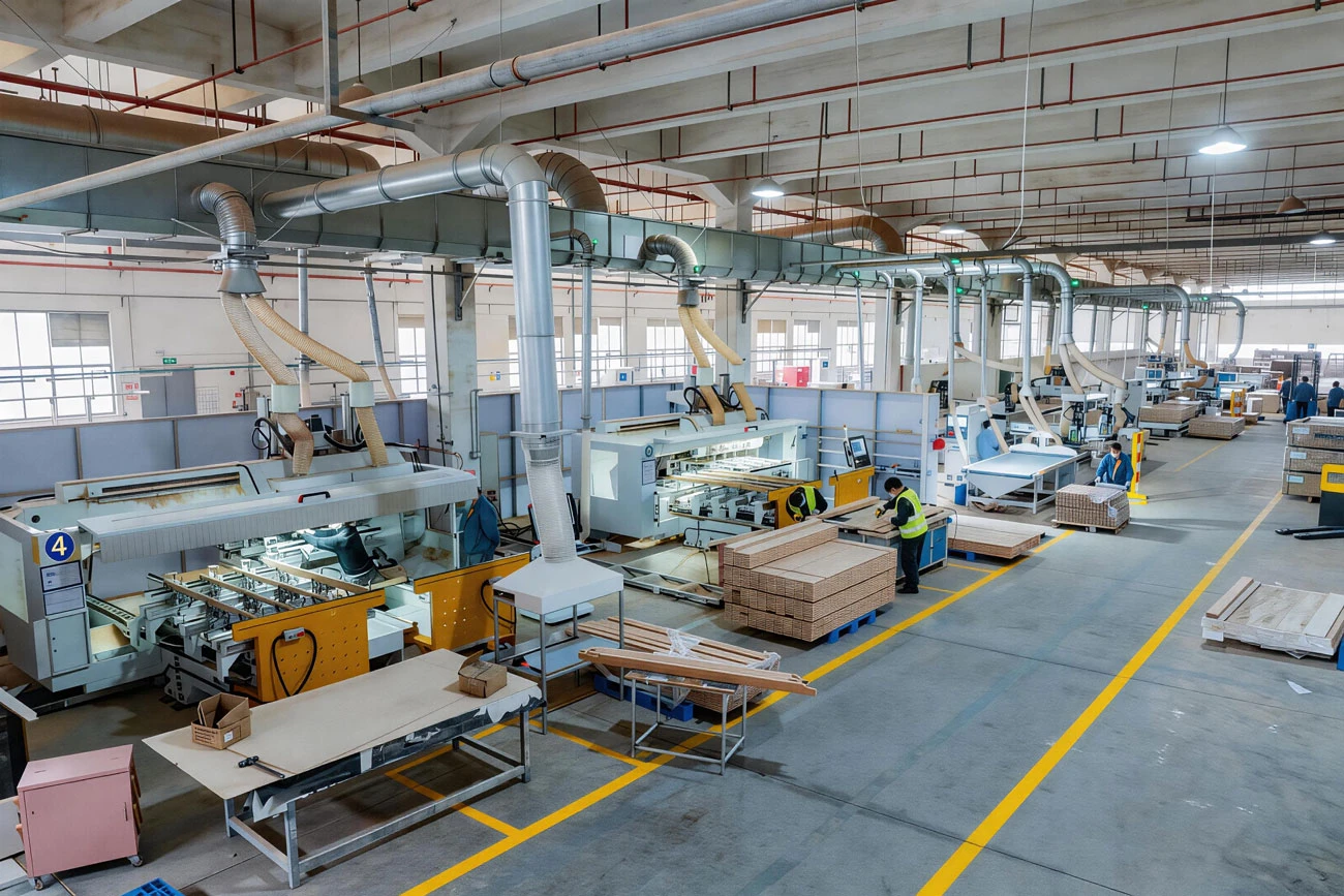 CNC woodworking machines and workers inside the Hanhao furniture production workshop CNC woodworking machines and workers inside the Hanhao furniture production workshop